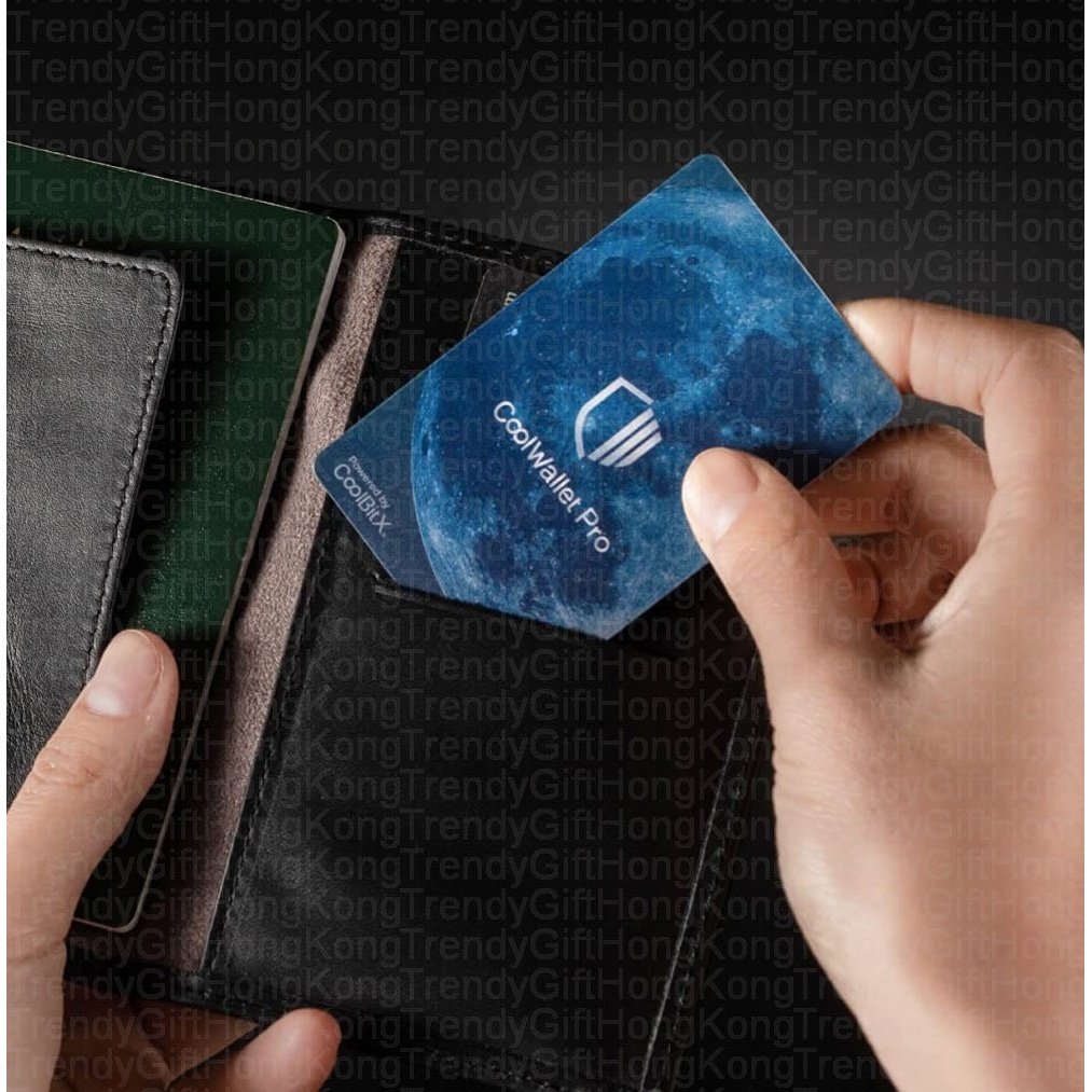 CoolWallet Pro — hands pulling blue card-sized device from black leather wallet