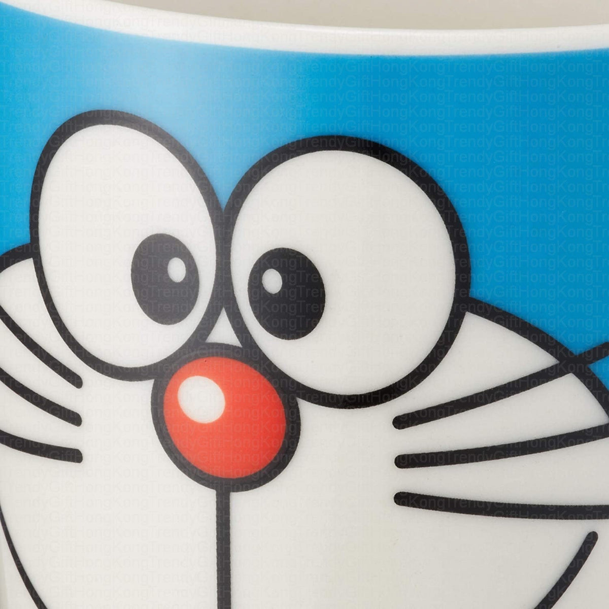 Close-up of Doraemon artwork on the blue ceramic mug