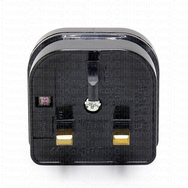 Front face of the black fused adapter with a UK three-pin socket