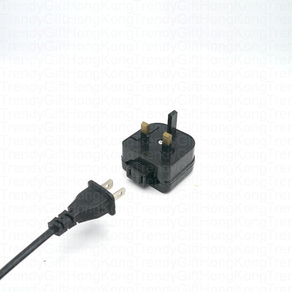 Converter adapter beside a two-flat-pin power cord plug