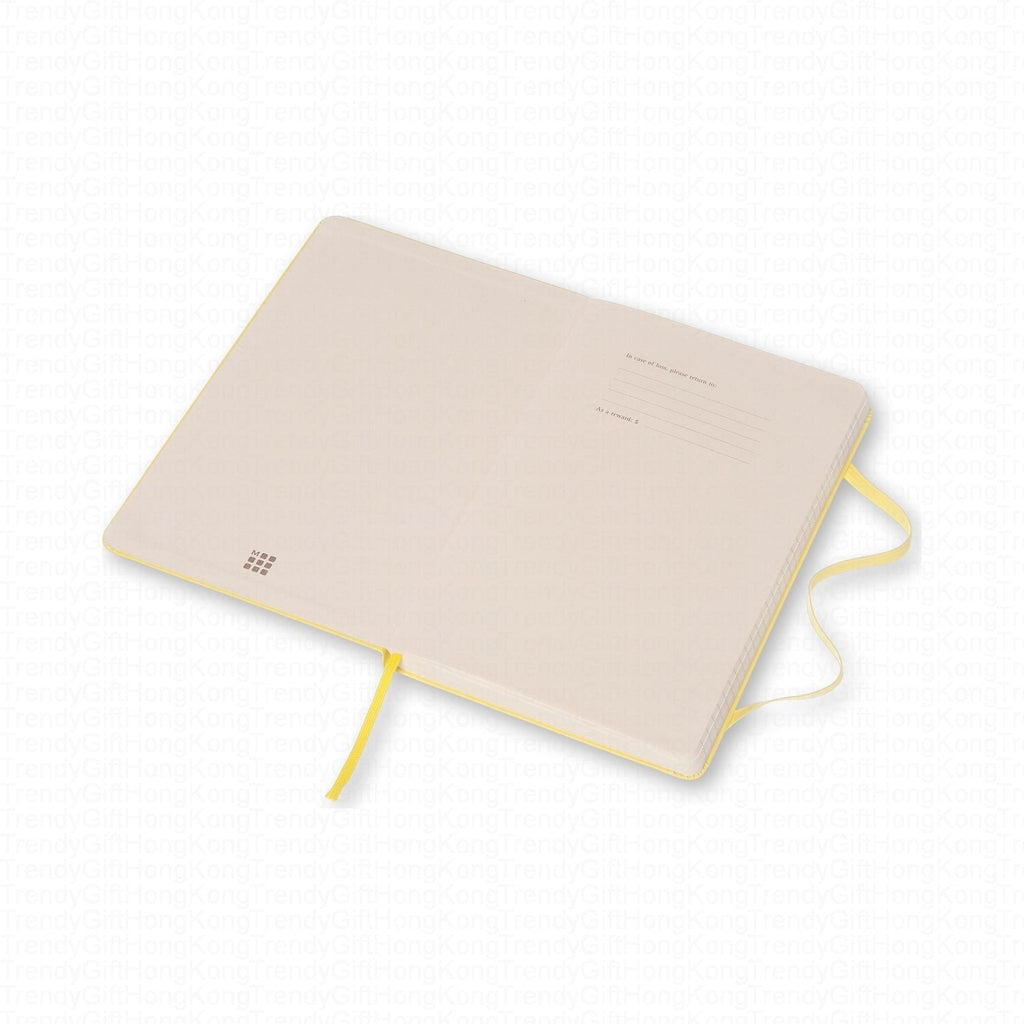 Pale back cover of the yellow Moleskine notebook with yellow ribbon marker
