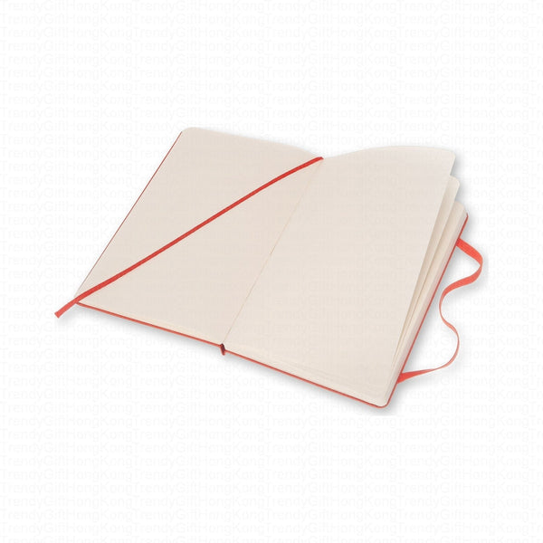 Open red Moleskine notebook with ruled pages and diagonal elastic