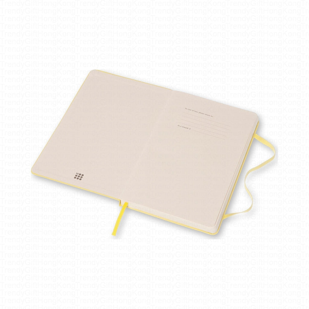 Pale underside of the yellow Moleskine notebook with yellow ribbon