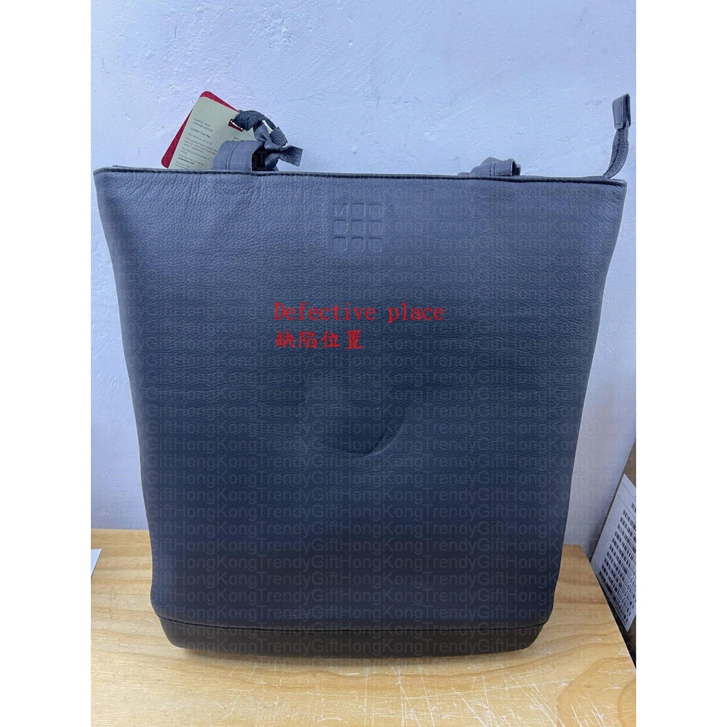 Black Moleskine tote bag with the disclosed defect location marked in red