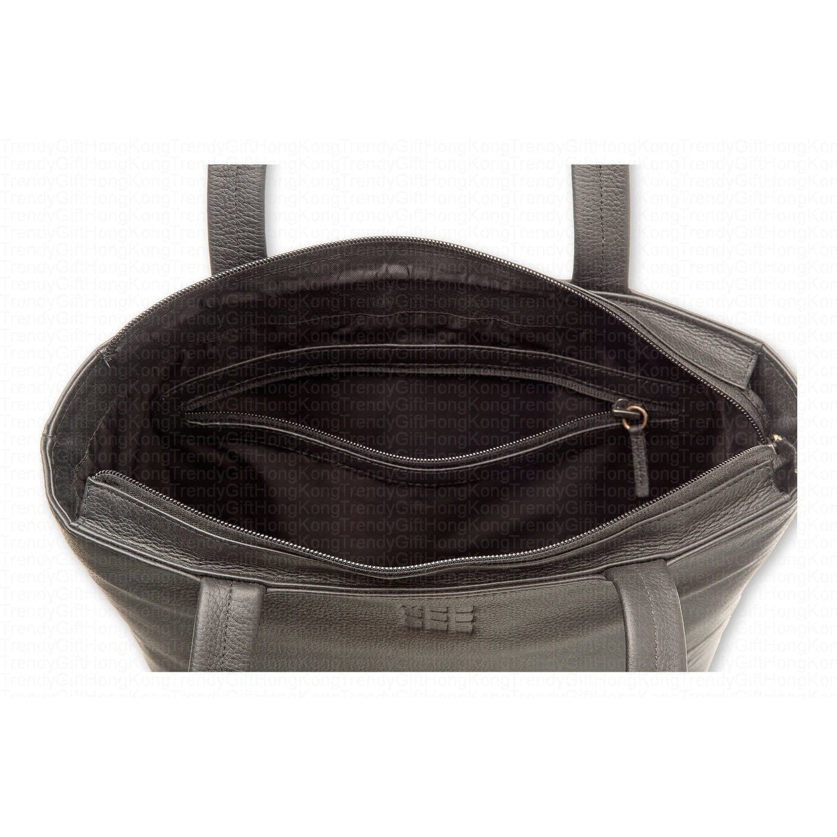 Interior of the black tote bag showing its lining and inner compartment