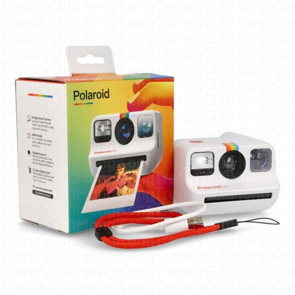 White Polaroid Go camera beside its colorful box, red wrist strap and white cable.